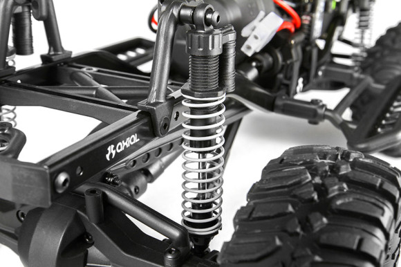 ADJUSTABLE COILOVER SHOCKS In the suspension department, the SCX10™ features single coil springs over oil filled shocks which allow you to tune the dampening rate. Shock hoops on the SCX10™ frame allow for multiple shock positions for tunable performance. There's also coilover shock reservoirs for realistic scale looks.