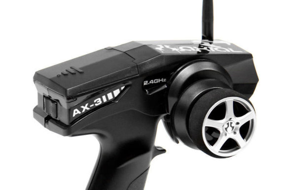 2.4GHz RADIO FOR WORRY-FREE DRIVING The AX-3 2.4GHz transmitter is a two channel, pistol grip radio with servo reversing switches for steering and throttle, trim dials for fine tuning steering and throttle centers. The battery indicator light also lets you know when your transmitter batteries run low. 